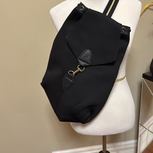 Papillonner Chic Black Backpack with Gold Accents pre-owned. main image 4